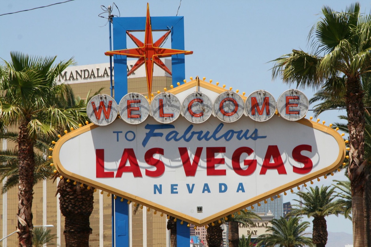 Neon sign 'Welcome LasVegas' in night time lighting